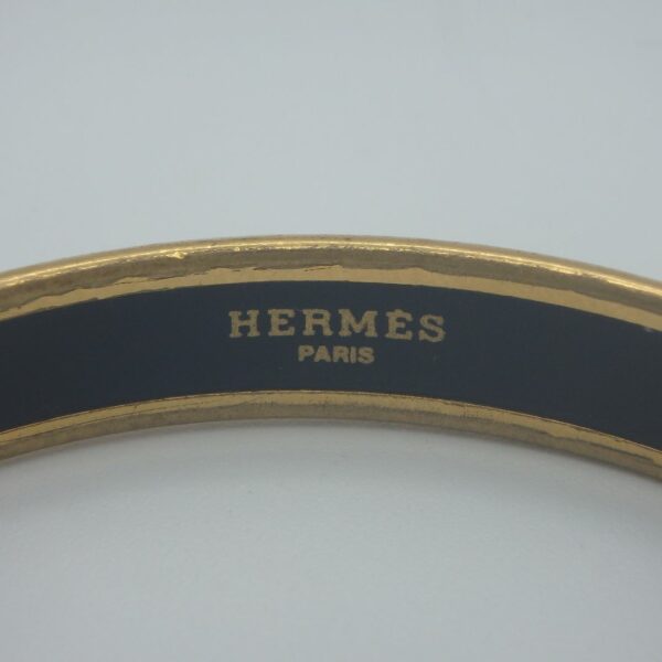 Bracelet Jonc d'occasion Hermès en métal doré et émail
